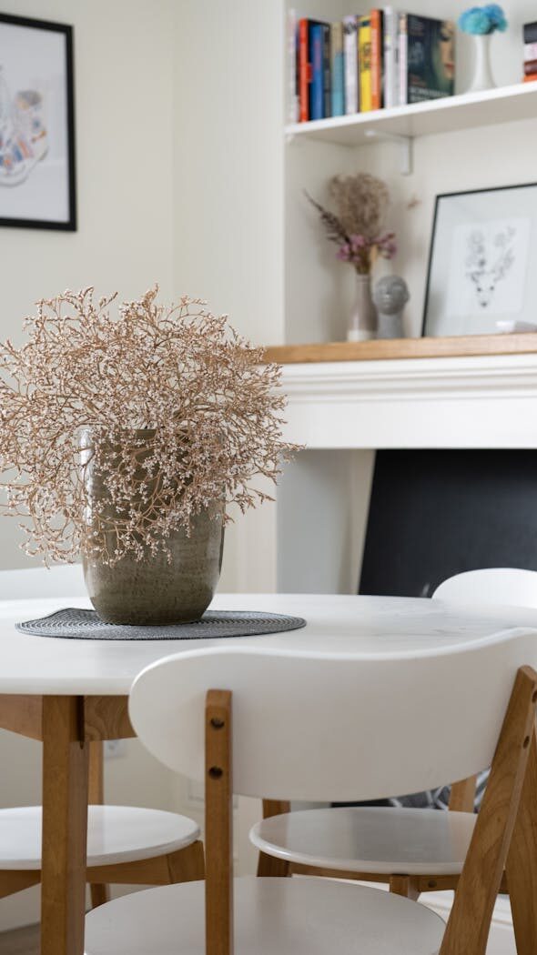 Stylish dining room featuring a minimalistic table setup, elegant decor, and classic furniture.